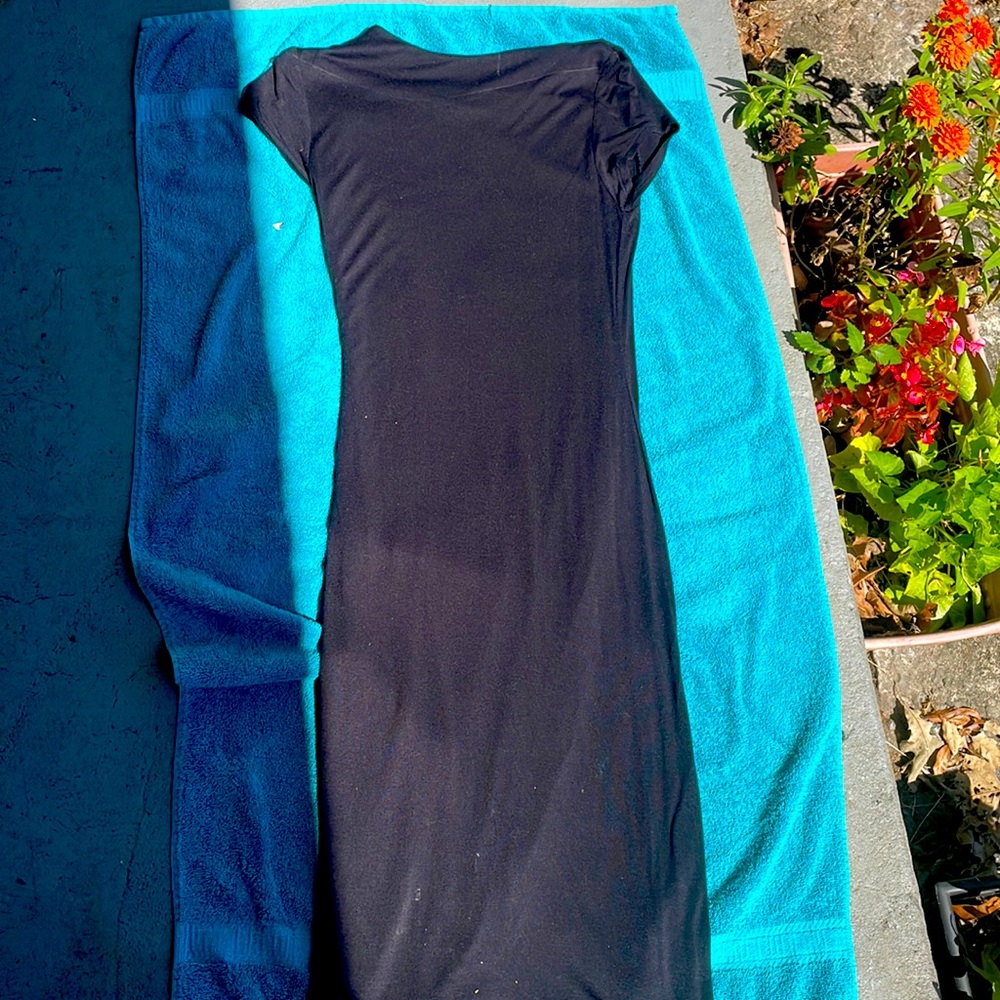 I’m selling a knee long black dress . Only worn twice .